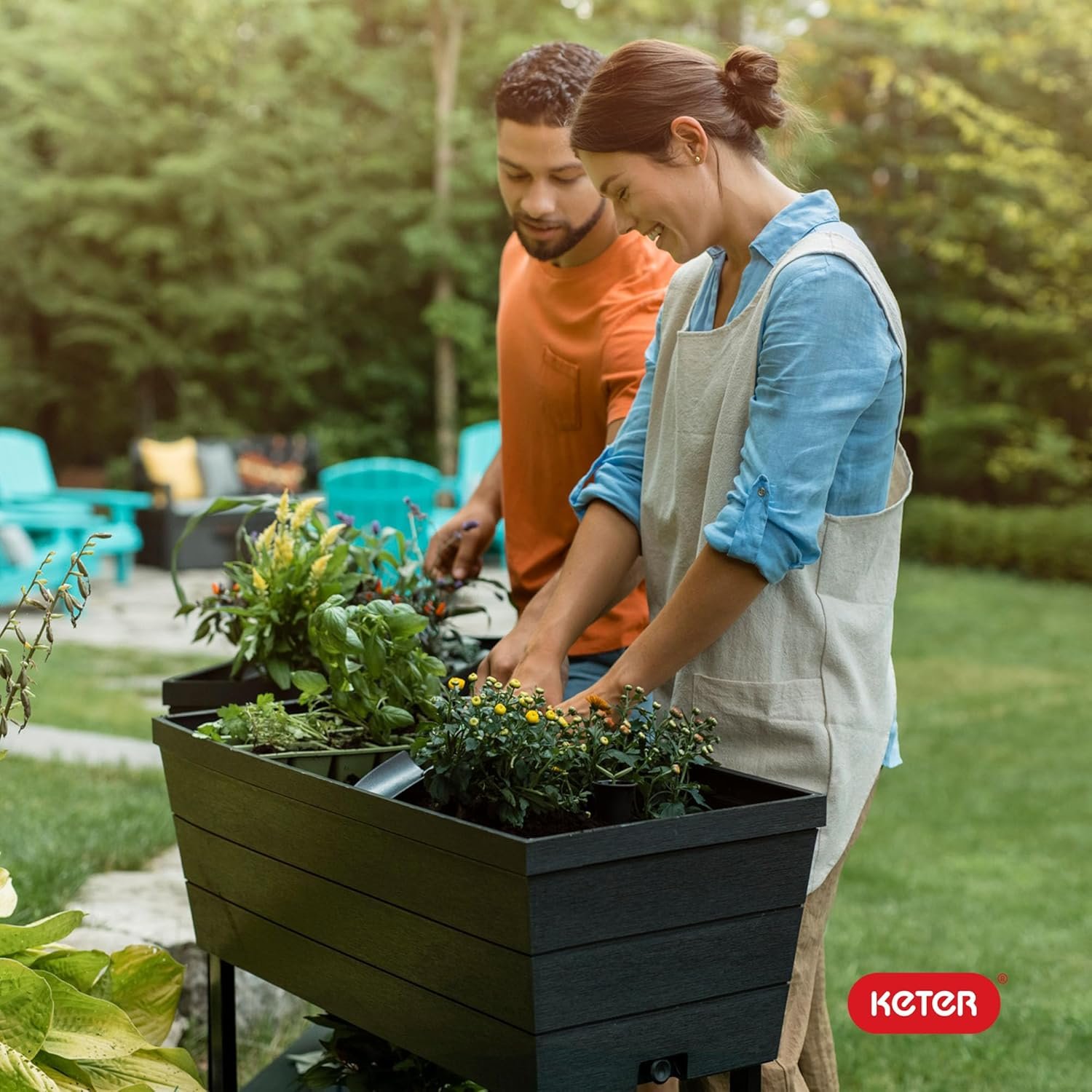 Elevated garden bed full of vegetables and herbs growing